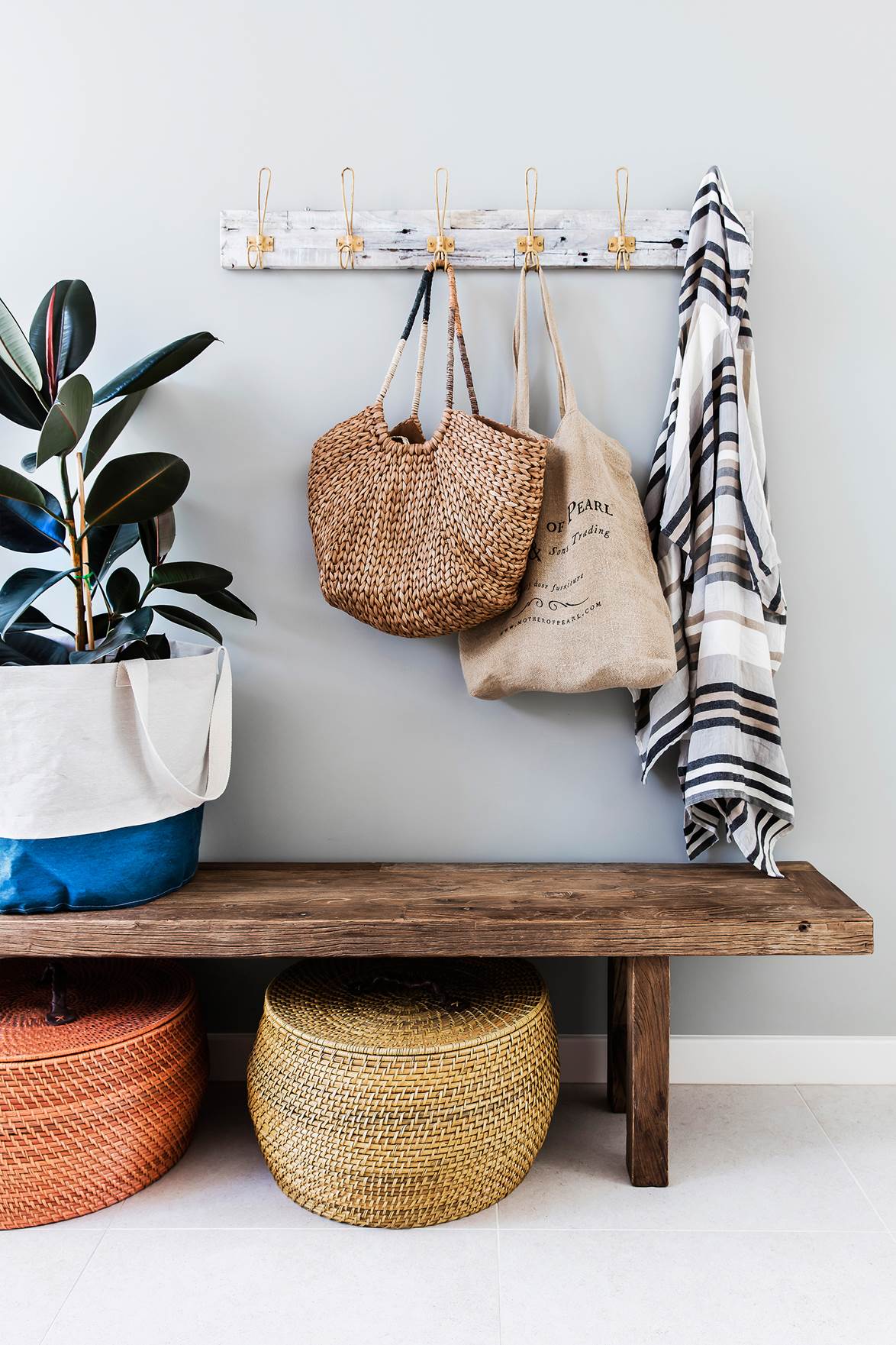 reusable bags hanging in hallway